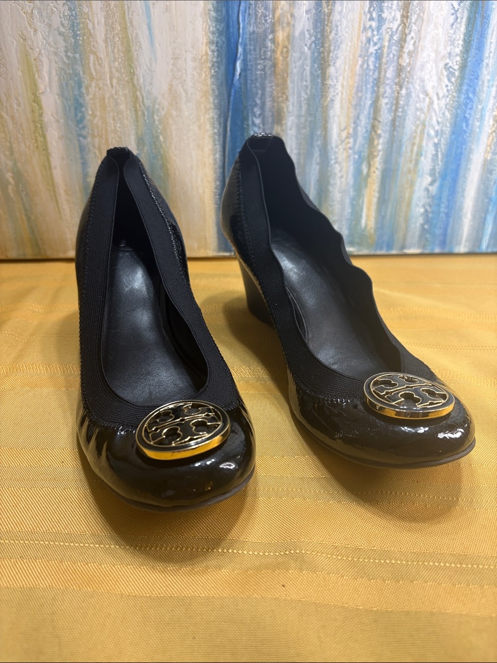 Tory Burch Patent Wedge Pumps with Gold Emblem